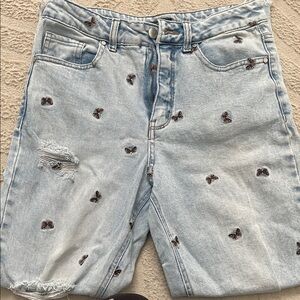 Material Girl light blue butterfly embroidered ripped jeans